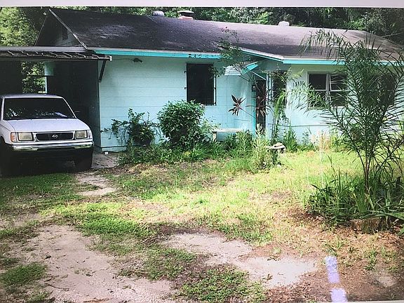 Front of Home w/ carport