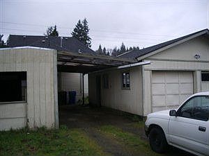Back of home - detached carport and garages