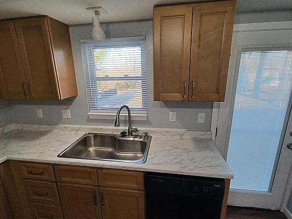 Kitchen sink. Patio door.