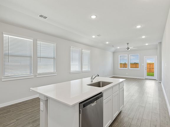 Kitchen in the Elm home plan by Trophy Signature Homes - REPRESENTATIVE PHOTO