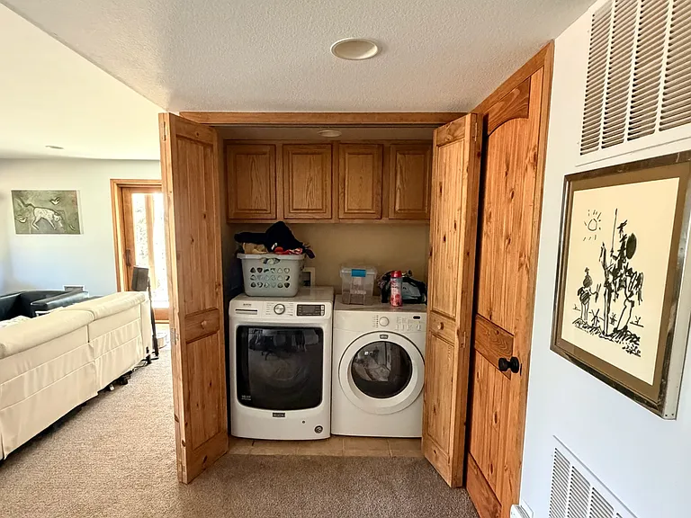 New washer. Dryer with cabinet space for storage