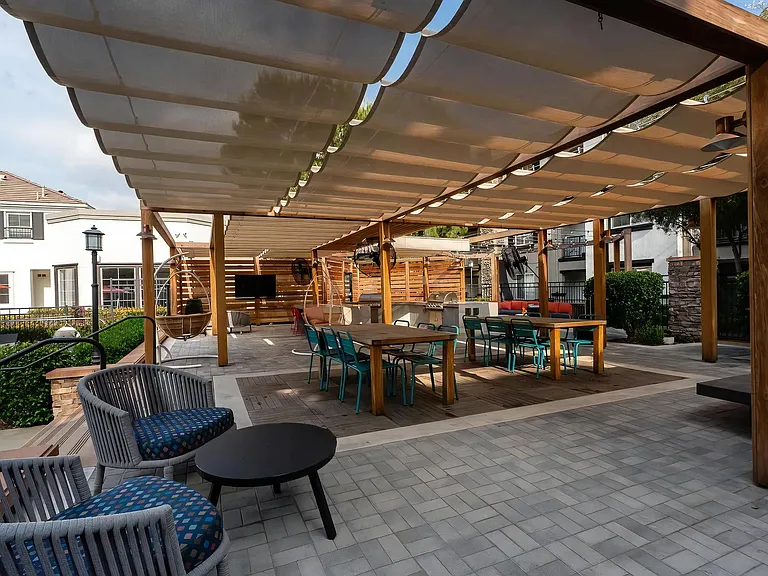 Outdoor Covered Patio with Grilling Station and Dining Tables