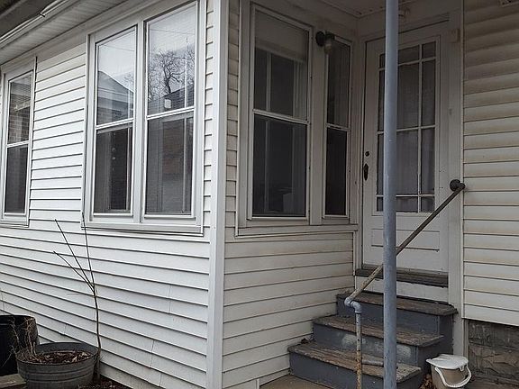 Sunporch (3-season porch) off east side of house, plus side entrance