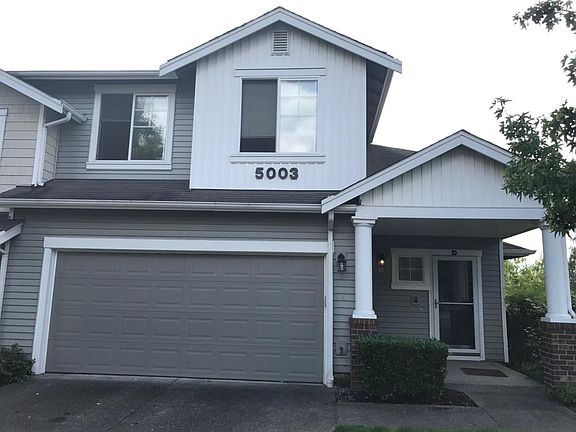 Private end unit with territorial views, garage parking for