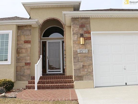 Showy brick entry steps and landing.  Sun shade pulls down that is also privacy....you can see out but can't see in!!!  Eves have have extra electrical plus lights in eves for evening lighting.