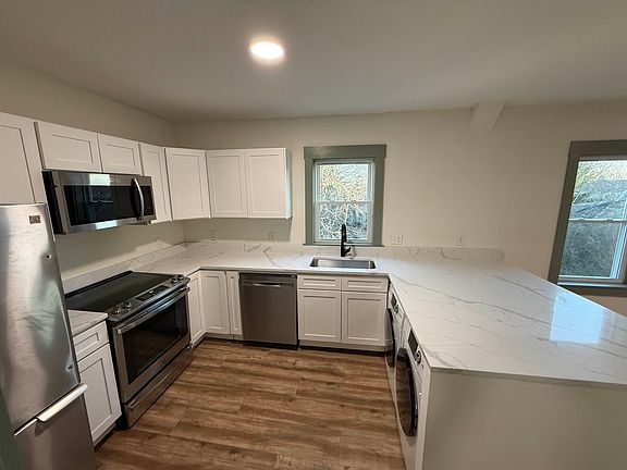 Kitchen with washer and dryer