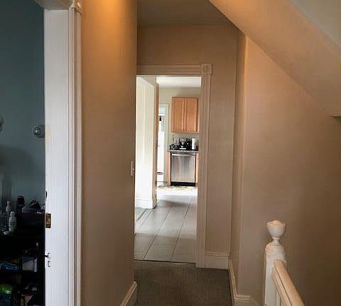 Entry to 2nd floor BR (left), down toward kitchen & LR
