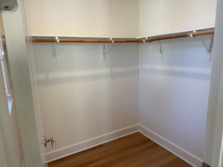 Primary bedroom first closet