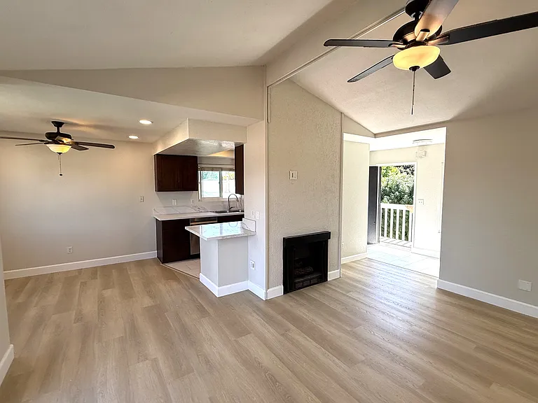 Living room showing front door and dining room on the left
