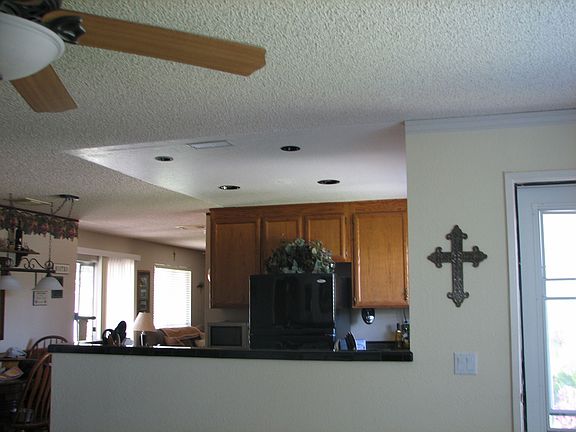 Kitchen, eatting area to left side, front door to right and f/R view from L/R