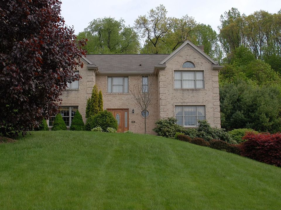 All Brick Beauty Amidst Lush Landscape