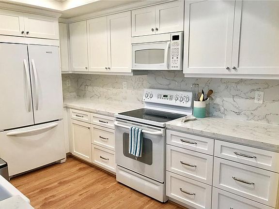 Remodeled kitchen, refrigerator and built in microwave included.