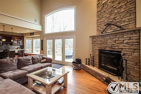 Open floor plan. Dramatic 2 story fireplace in the great room. Lots of natural light. Lovely wood fl