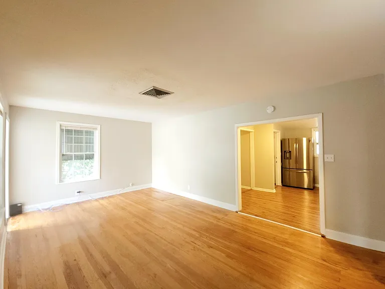 big open living room with original hardwood floors