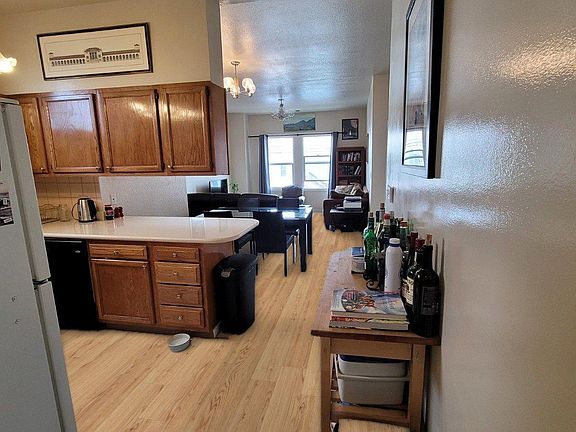 View of living area and kitchen from entry of bedroom 3