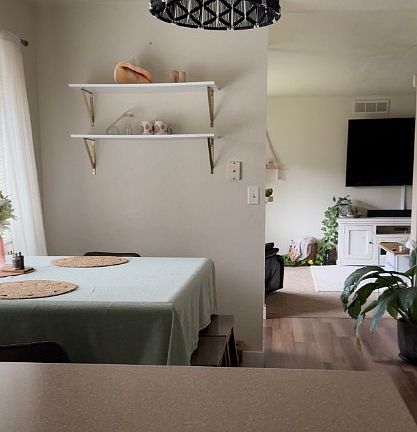 View of the dining area and living room area taken from the kitchen.