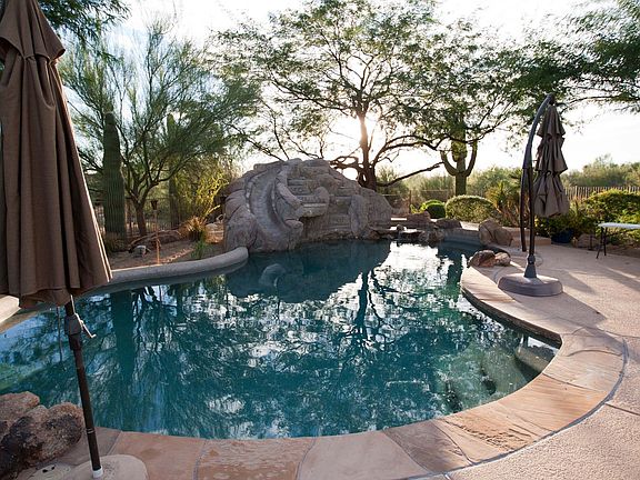 Pool with water slide and misters