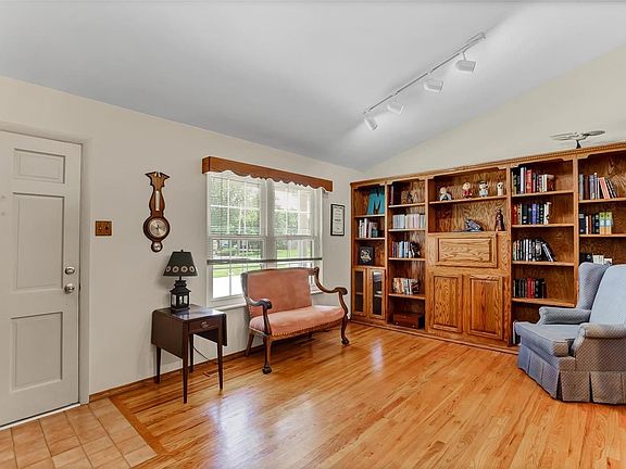 Front room currently being used as a study w/ built in book cases, hardwood floors, half vault.  could be used as additional dining space or living room.