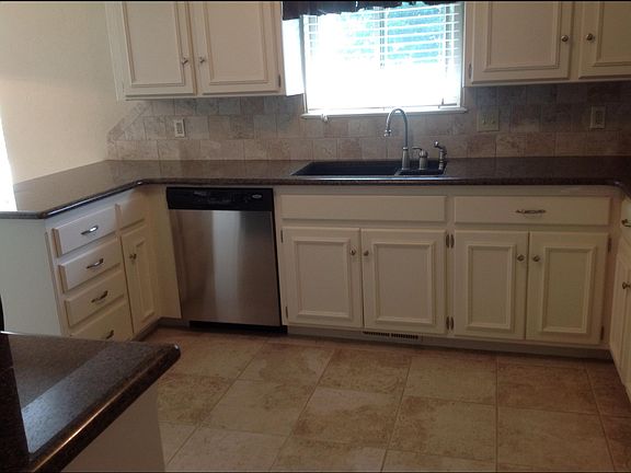 Kitchen opens to large living area