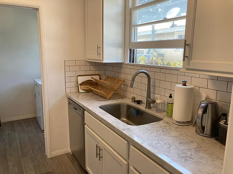 Kitchen sink + laundry room entrance - previous tenant A