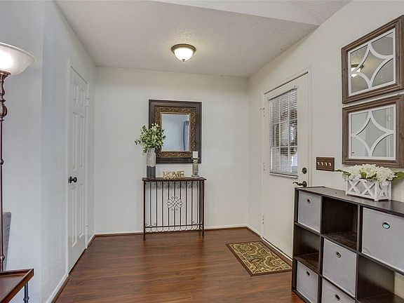 Hazel-colored wood laminate flooring greet you upon stepping foot into the spacious foyer; delight your guests with the most welcome of settings. A coat closet is conveniently located just across the way.