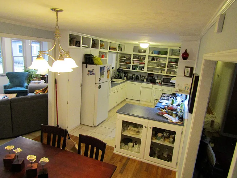 Dining room and kitchen with the sun room in the background.