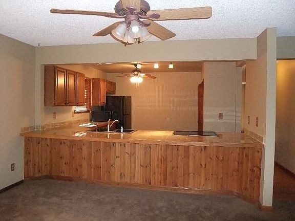 Breakfast bar running full length of kitchen.