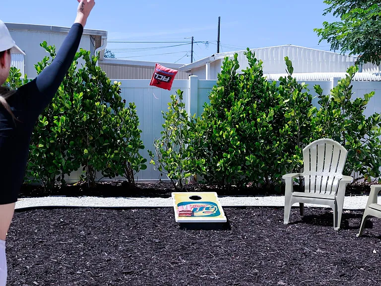 Test your bean bag throwing skills with corn hole game in the back yard.