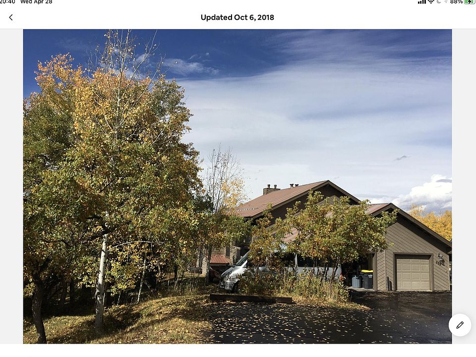 Street view of duplex unit (left side) 2 off street parking spots, smaller single car garage.