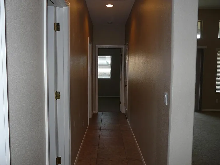 walk way to all 3 bedrooms on left side of the house and one full bathroom /master bedroom is located on other right side of the house ( facing from south side)