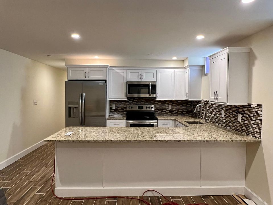 Brand new, beautiful kitchen with large island, dishwasher, range, microwave, etc!