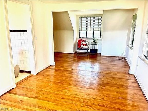 LIVING ROOM AREA WITH COX CABLE HOOK UPS.