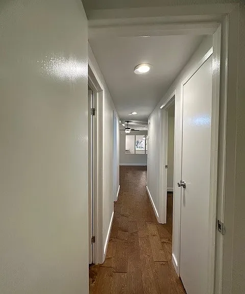 HALL LEADING TO 1ST BATH AND TWO BEDROOMS