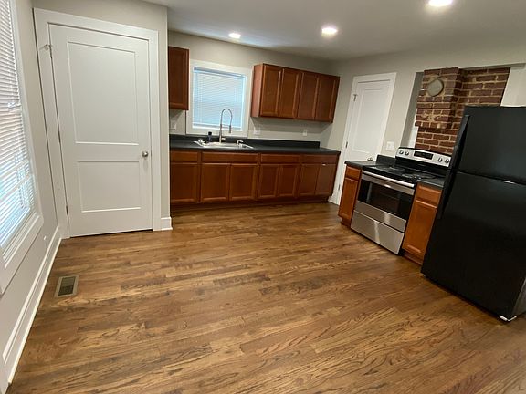 Door to the left in the photo is where the washer and dryer are placed.