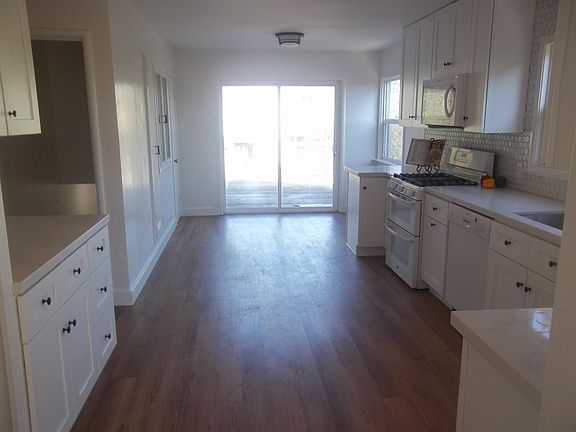 View from Dining area to deck area off kitchen New vinyl flooring
