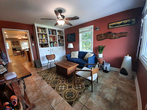 Sunny living room, with built-in bookcase and storage unit