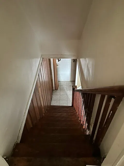 stairs to basement/kitchen/den/bathroom