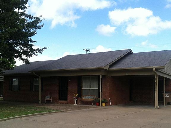 Double Driveway, Single Carport, Storage Building in back