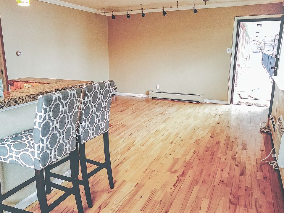 Dining room looking onto bar and living room