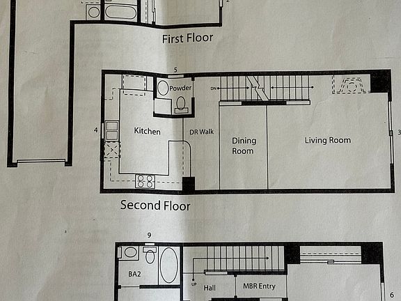 Floor Plan, First Floor has tandem Garage with Foyer and downstairs bedroom with ensuite bathroom. Second floor living, dining room, kitchen with access to outside patio, plus half bath. Third floor, 1 MBR and 1 bedroom with ensuite bathroom.