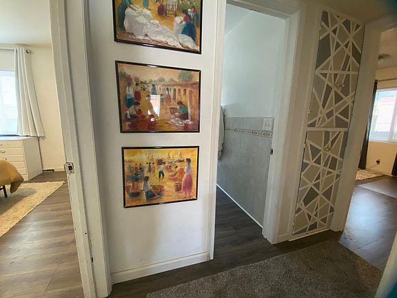 Hallway to the rooms with storage closet