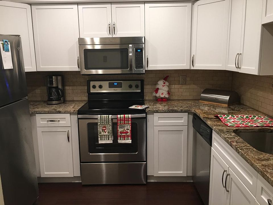 Kitchen with granite countertops and stainless steel applian