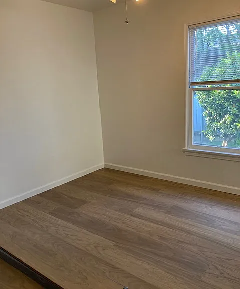 Bedroom has new vinyl planks.