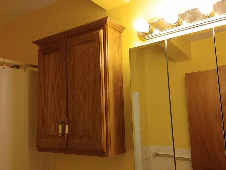 Three way mirror with medicine cabinet.