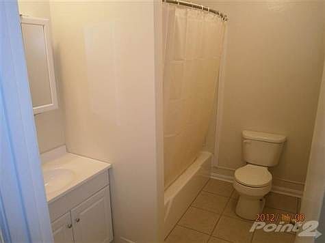 Full bath redone with tile floor and new vanity.