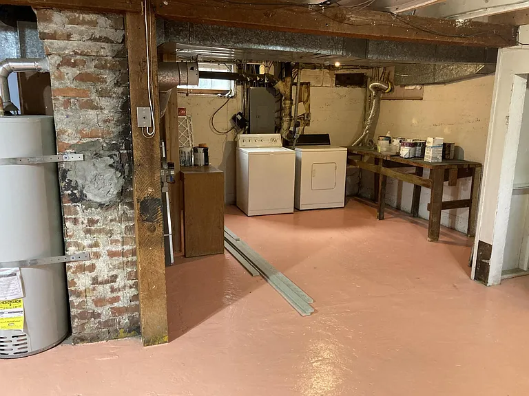 Laundry in basement, storage area