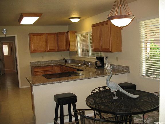 Granite countertops highlight the spacious kitchen. There's plenty of room for casual dining too!