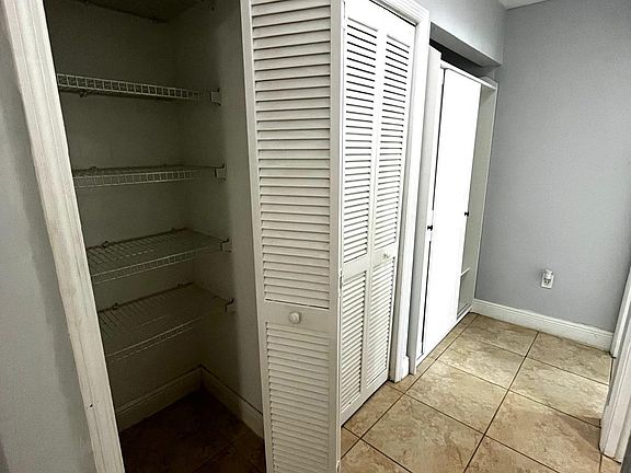 Hallway view with additional closet space.