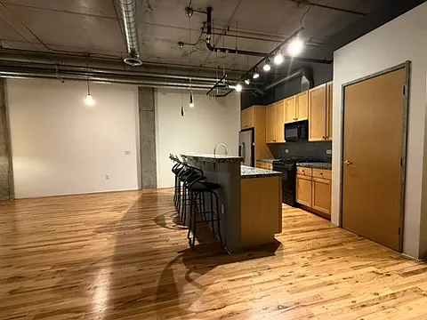 A well-equipped kitchen featuring modern appliances and excellent counter space for cooking and hosting