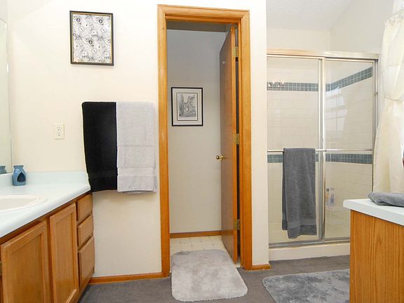 Master Bathroom with double sinks.  Shower. Toilet room. In Master suite.